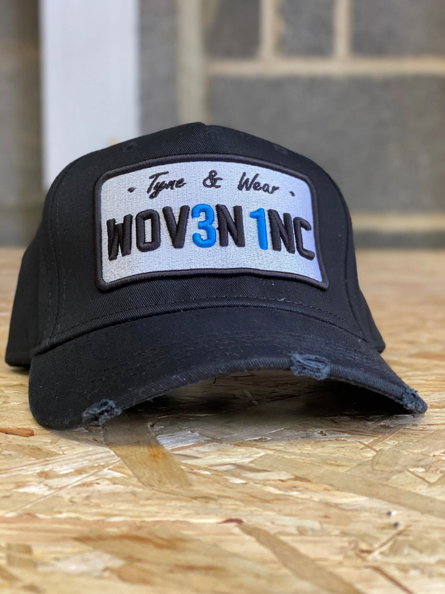 Black Plate Cap: Woven Inc Edition.