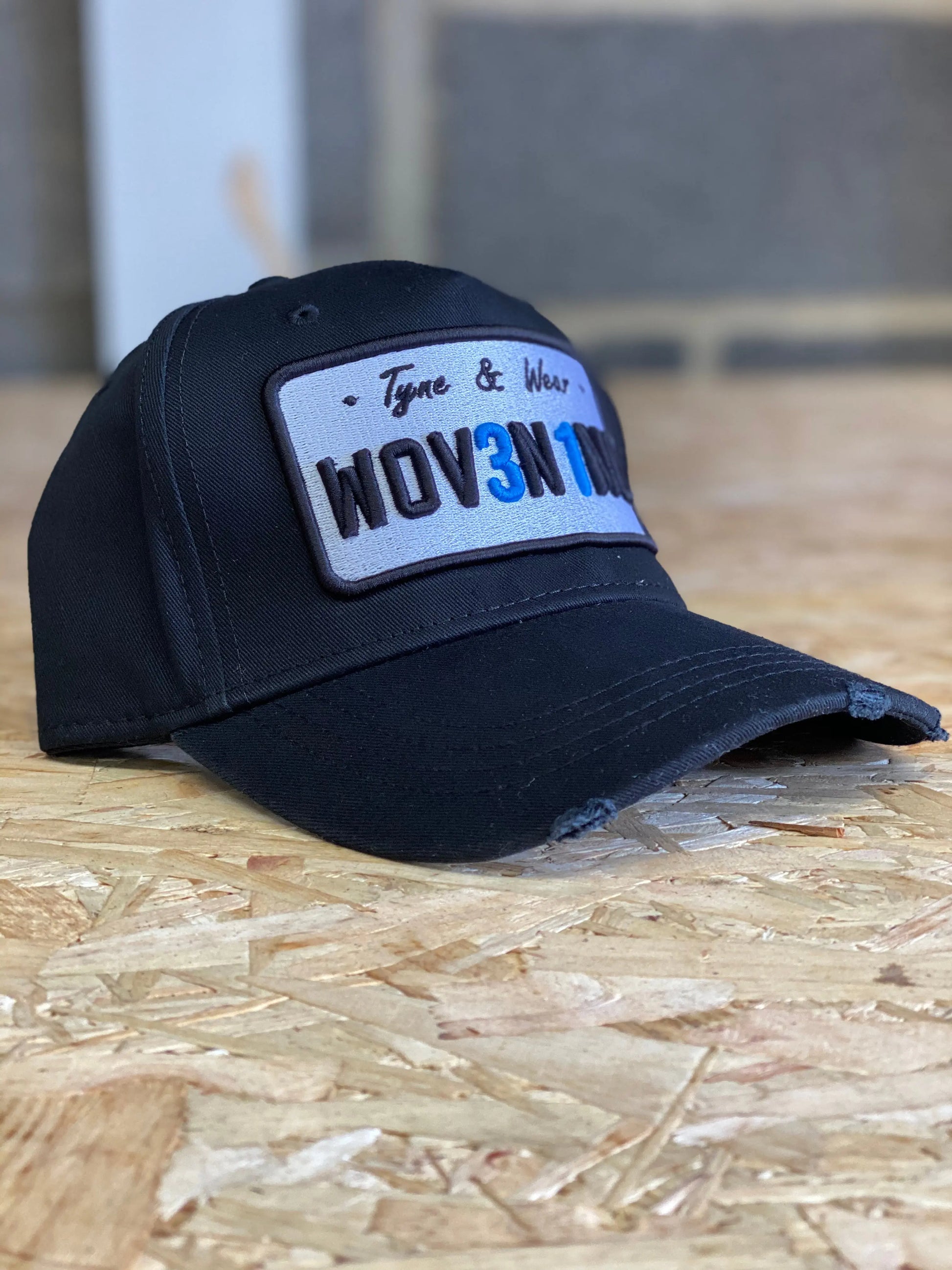Black Plate Cap: Woven Inc Edition.