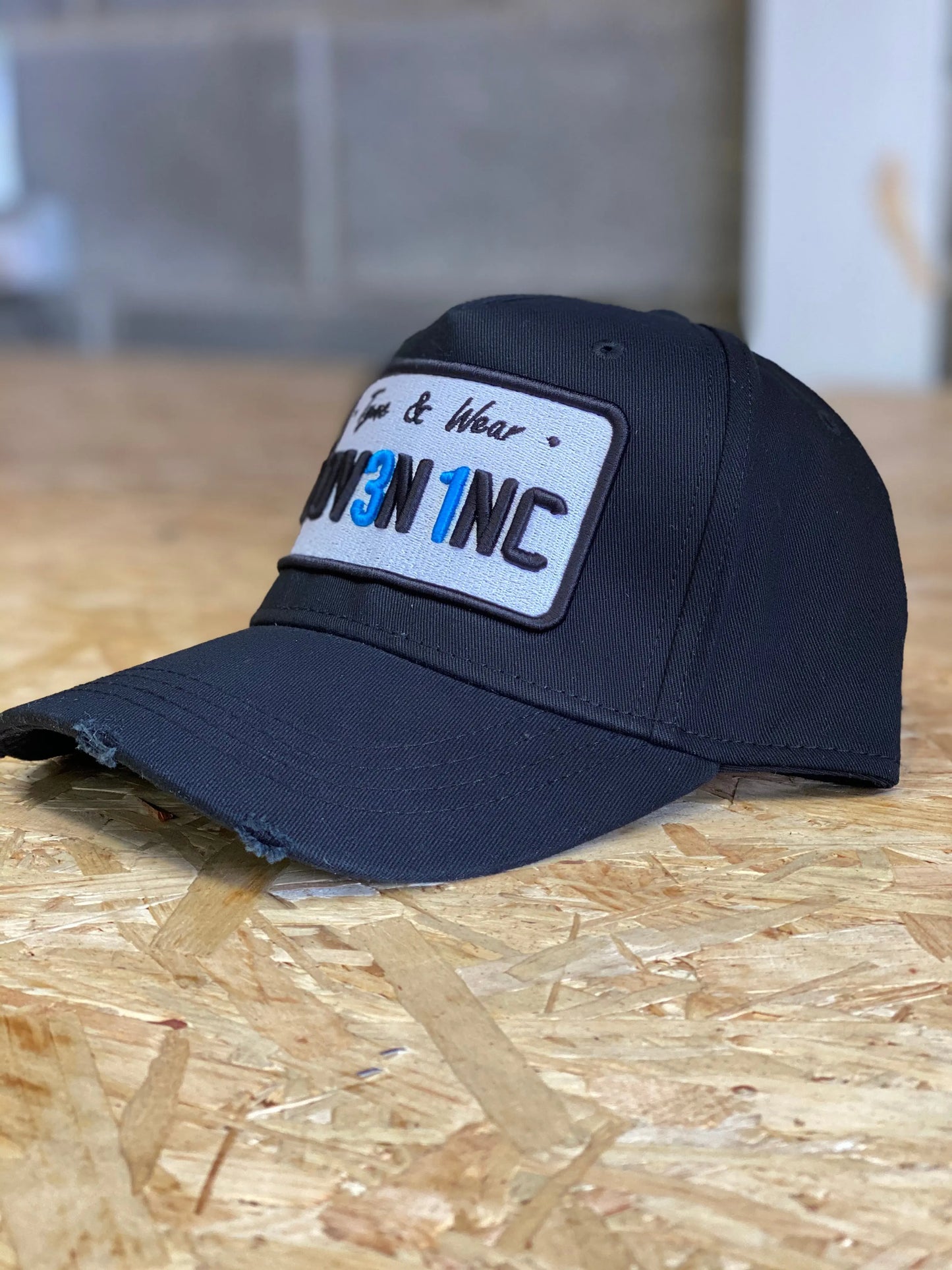 Black Plate Cap: Woven Inc Edition.